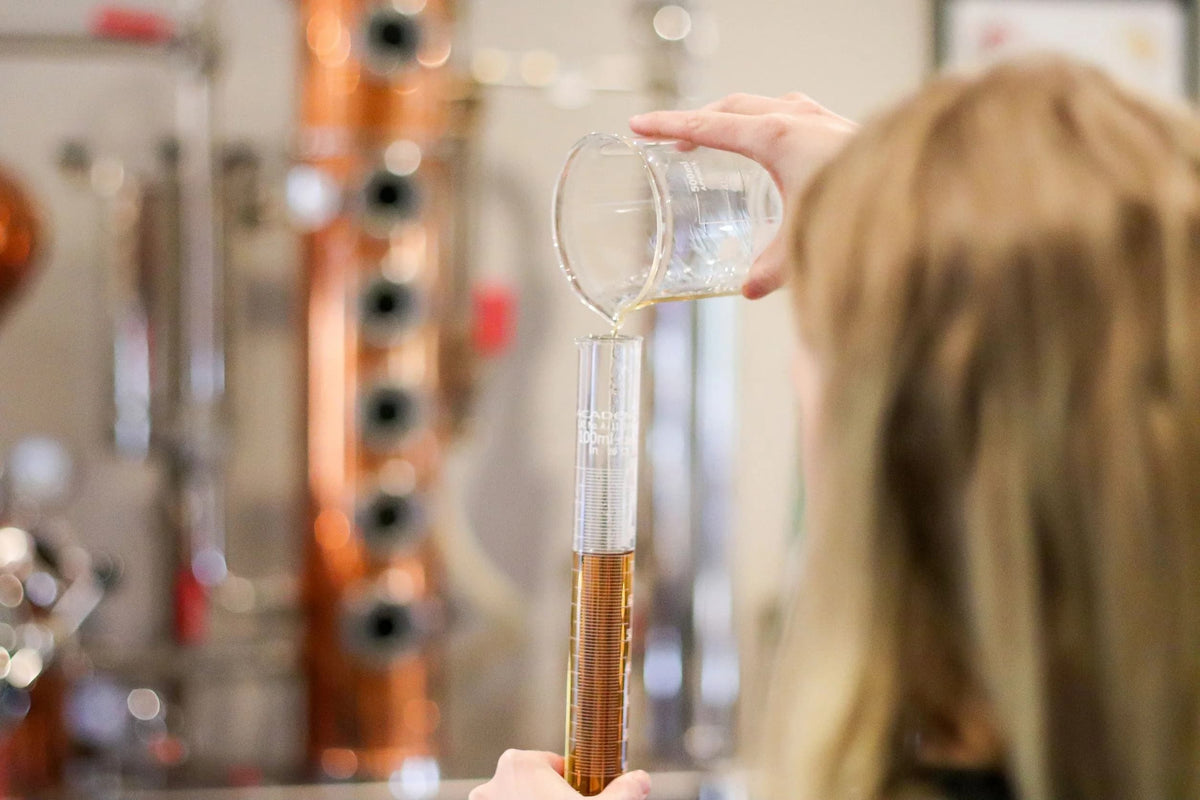 woman mixing liquids