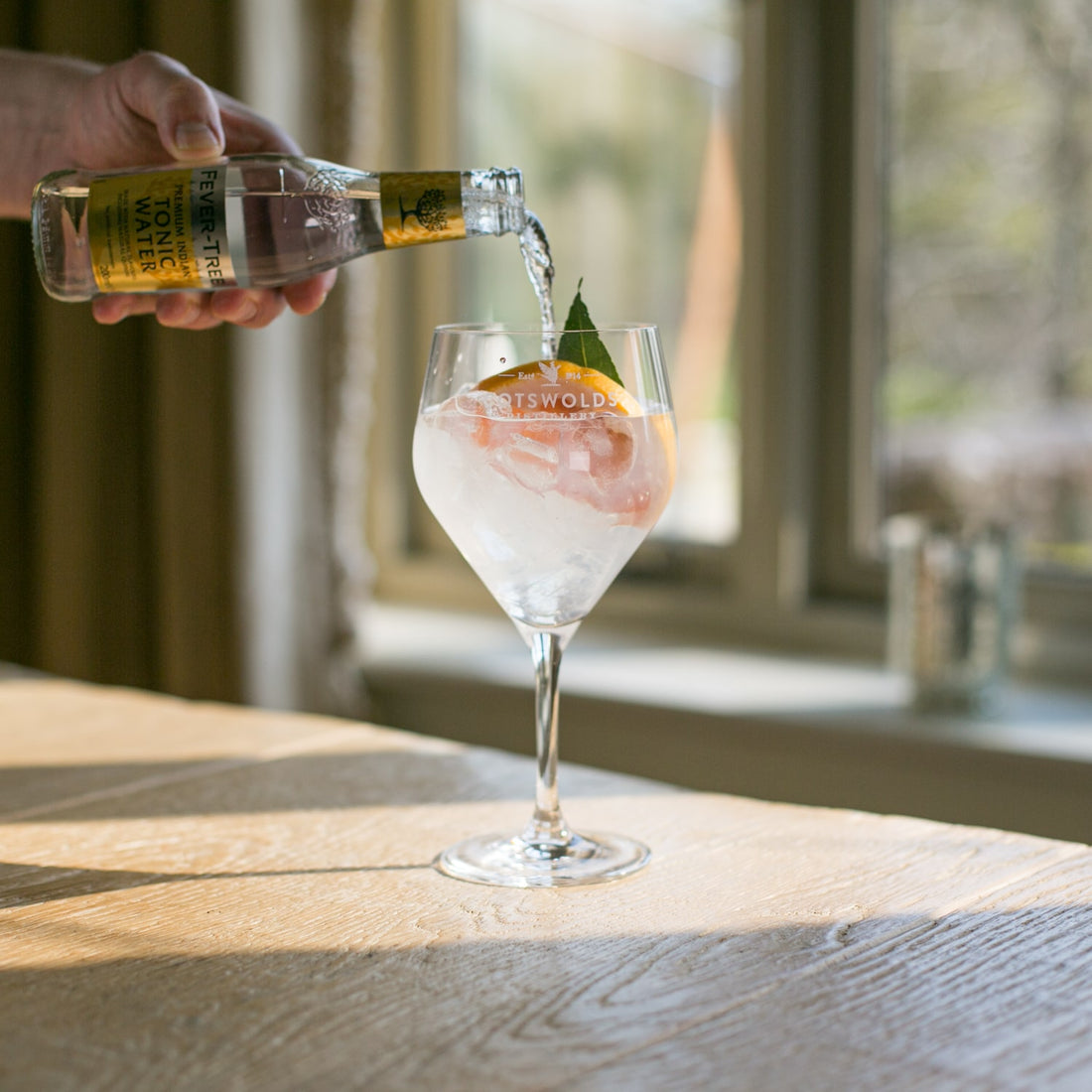 gin being poured into a glass