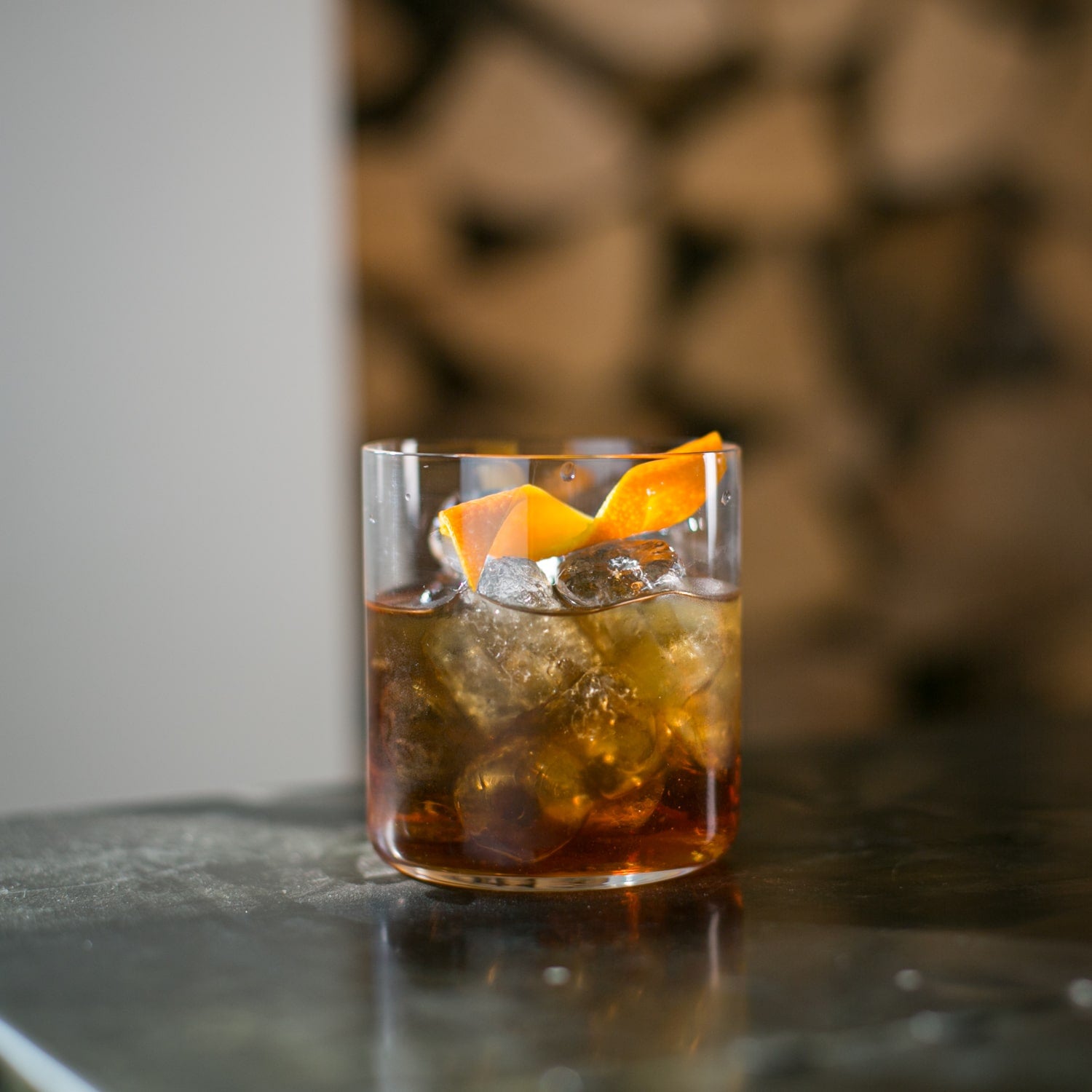 whisky amaro with ice and orange peel