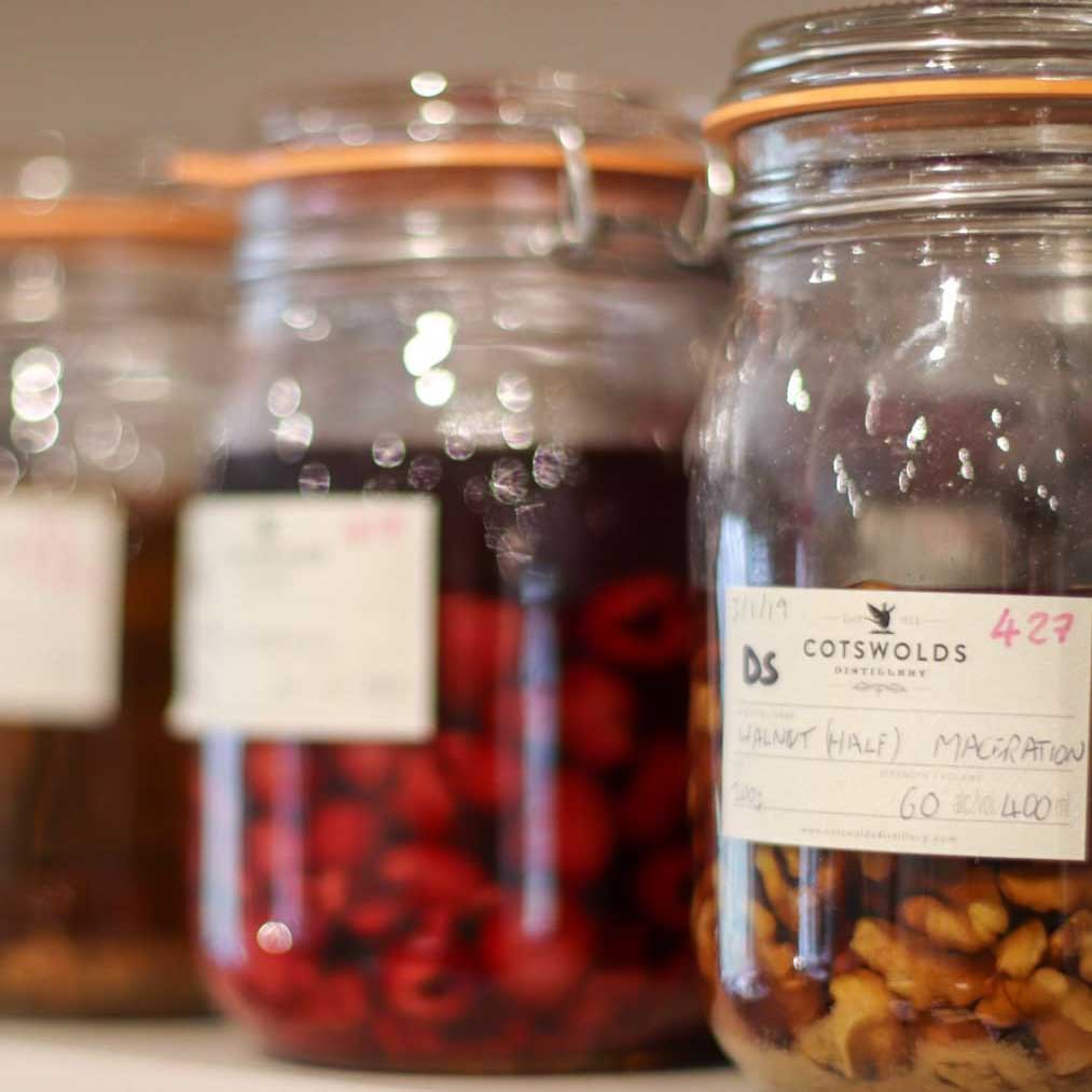 botanicals macerating in jars